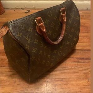 Well-maintained Vintage Louis Vuitton Speedy Bag.